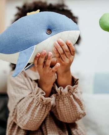 Boy Holding Whale toy